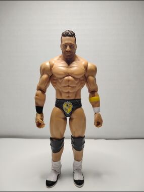 WWE Muscular Male Action Figure with Black Trunks and White Boots